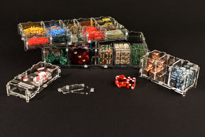 Crystal Fortress Storage Pods stacked onto of one another filled with dice, tokens, and gaming accessories.