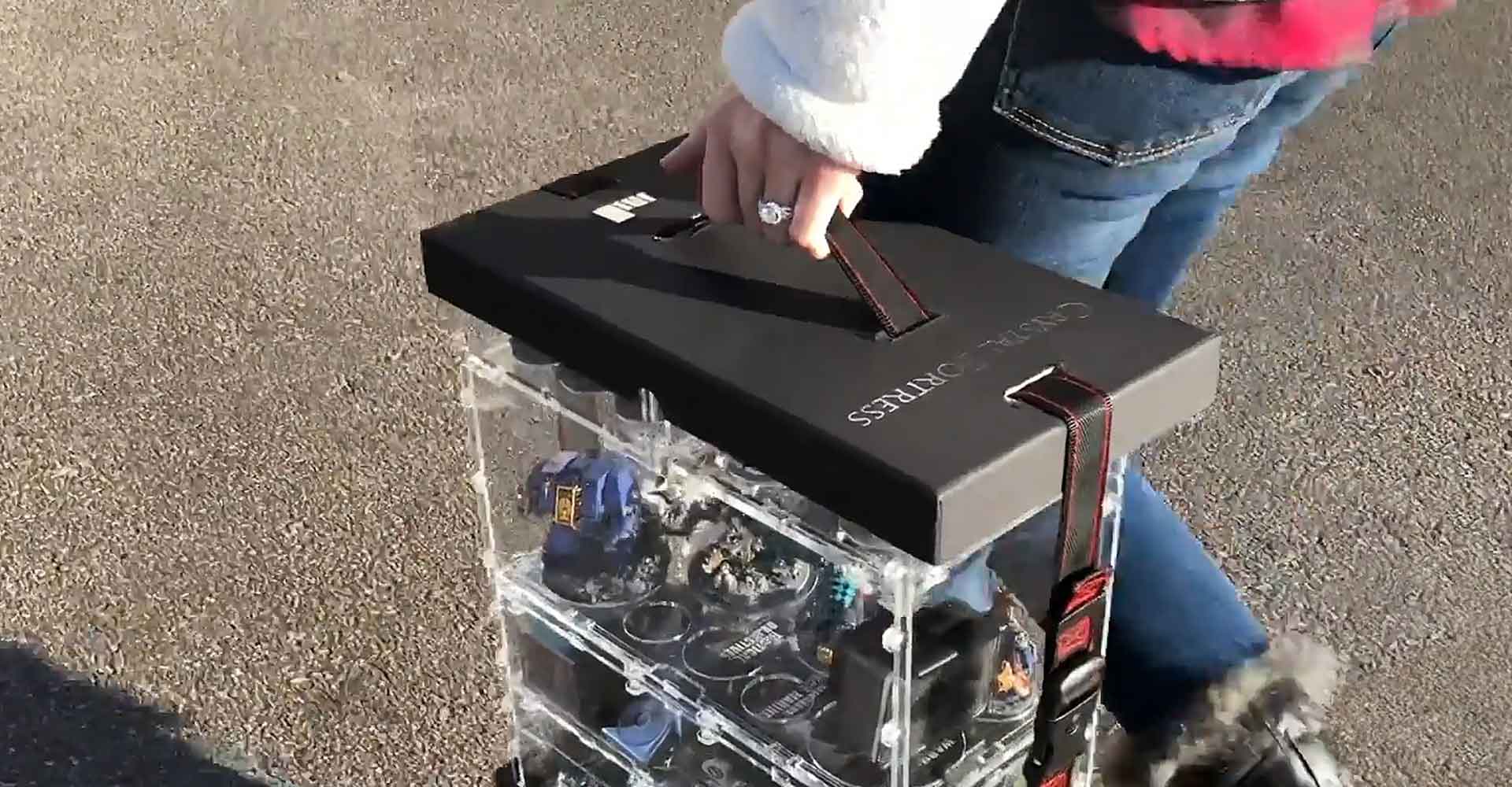 Carrying a crystal fortress display case system