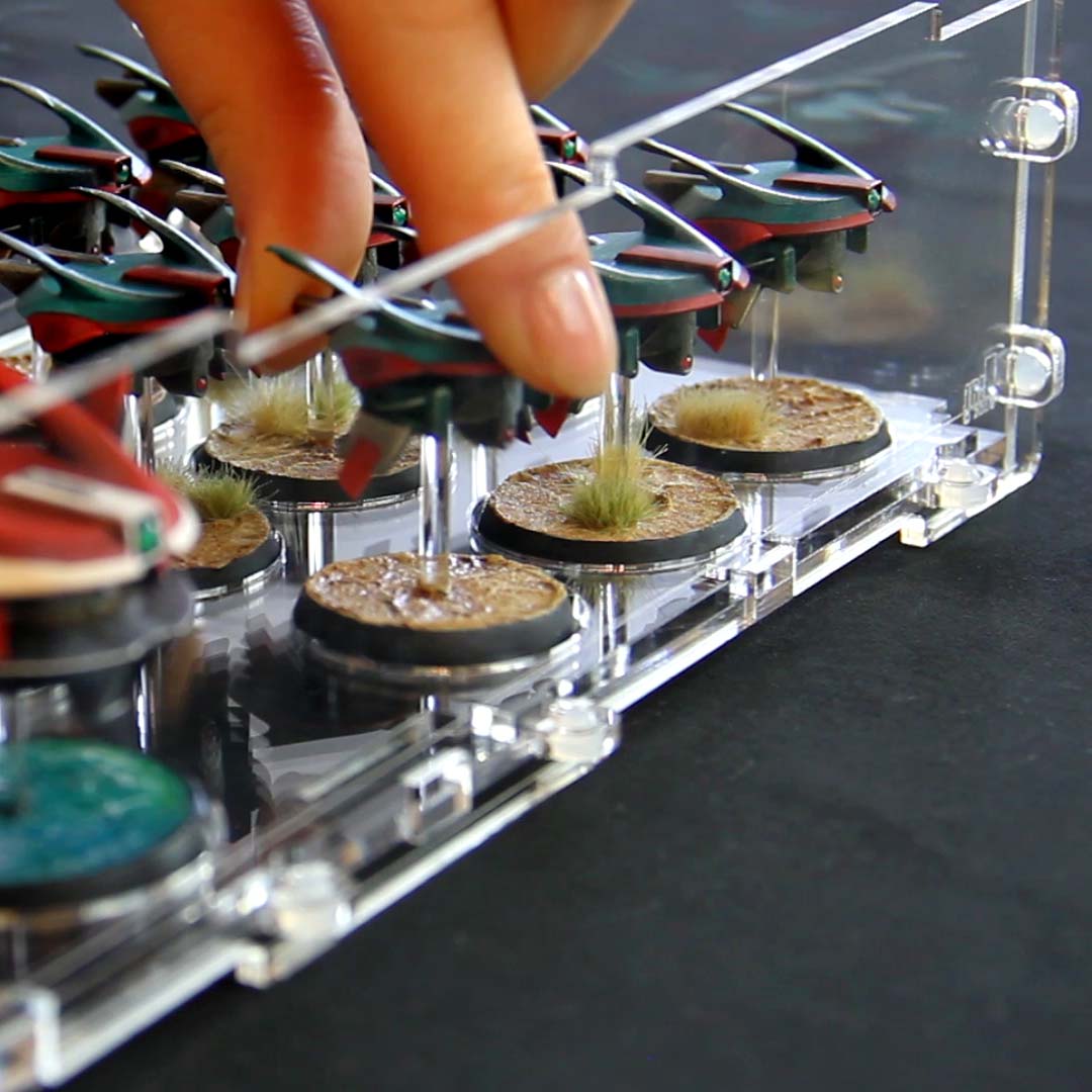 Loading miniatures into an acrylic display case