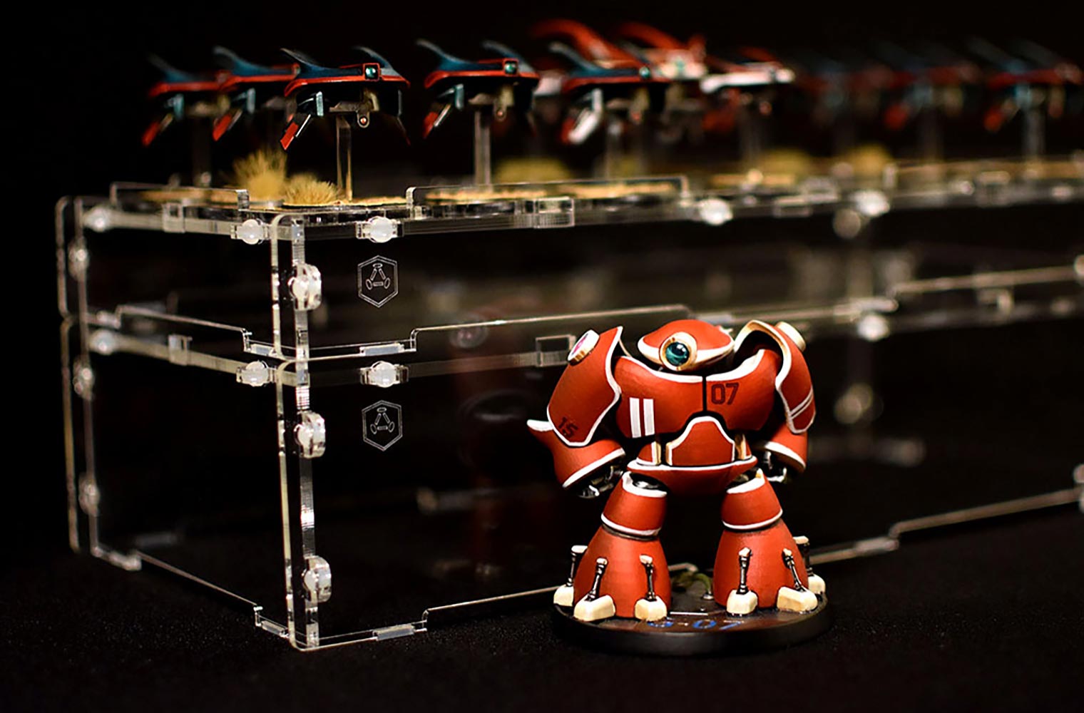 two acrylic case covers stacked with miniatures