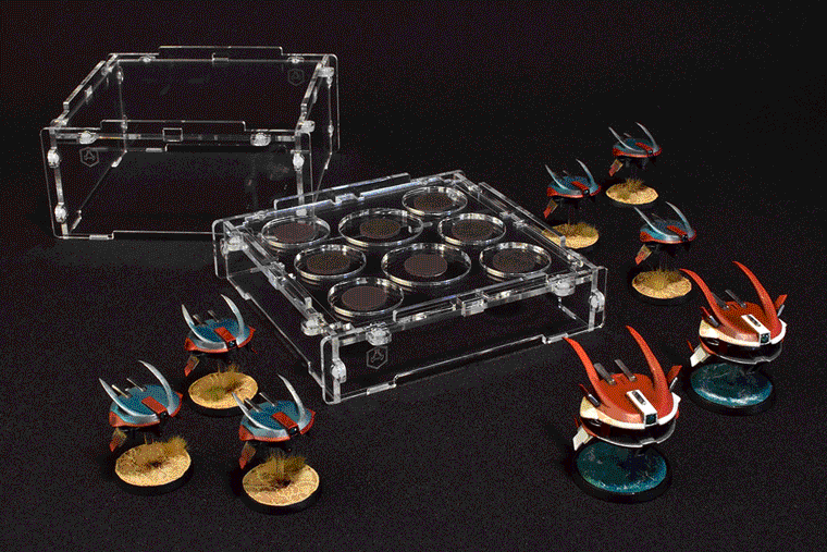 miniatures being loaded into a crystal fortress