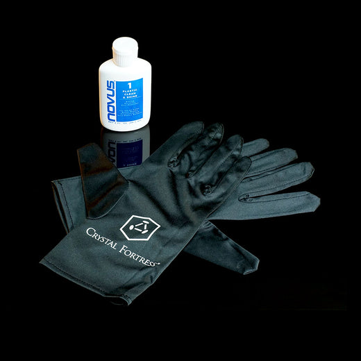 Crystal Fortress Cleaning Kit with microfiber gloves and Novus Acrylic Cleaner for maintaining pristine acrylic display cases.